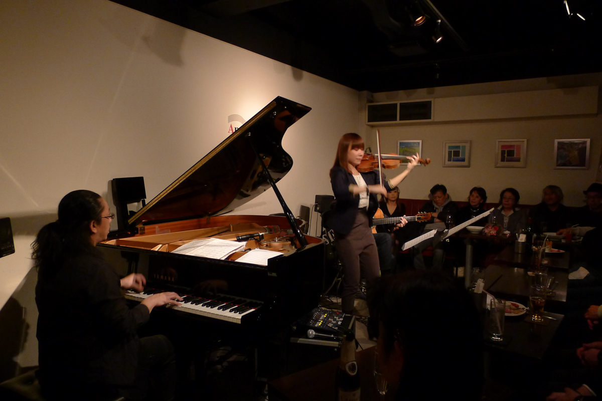 Figure 2: Maiko (violin) with Shikou Ito (piano) and Hiroki Miyano (guitar) at Apple Jump in March 2014