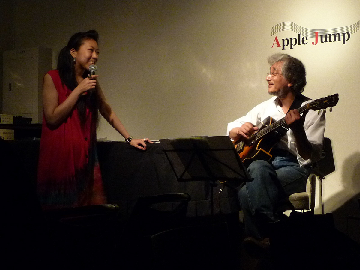 Figure 16: Yuka Ueda (vocal) and Shinji Hashimoto (guitar) at Apple Jump in June 2010