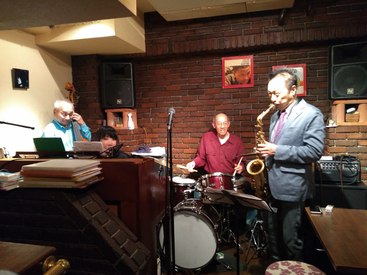 Figure 7: Bassist Satoshi Kosugi with Mayuko Katakura (piano), Kenichiro Murata (drums), and Kazuhiko Kondo (sax) at Gate One in 2019