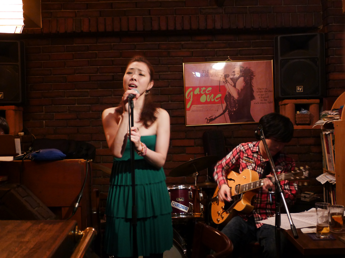 Figure 5: Sanae Ishikawa (vocal) with Takayoshi Baba (guitar) at Gate One in 2012