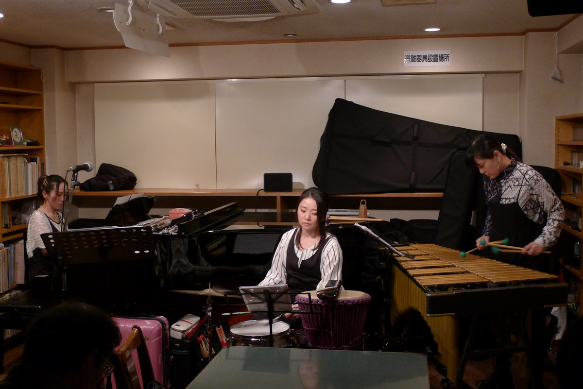 Figure 2: Toritoritori trio with Kana Fuefuki (flute, piano), Hitomi Aikawa (melodica, percussion), and Megumi Hattori (vibraphone, piano) at In F in March 2025. The name “toritoritori trio” could be interpreted as “bird bird bird trio”, nice wordplay where the rhyming punctuation of the English word ‘trio’ follows the three-times repeated Japanese word ‘tori’. It’s a great name for a band whose members frequently trade places on stage during a show and create soaring music flying between various instruments including flutes, lots of percussion, small keyboards, vibraphone, and piano.