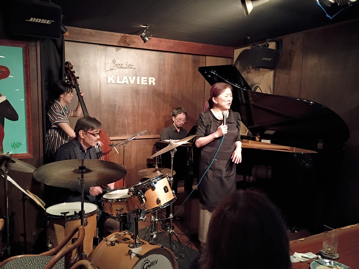 Figure 3: Owner Chika Toyota sitting in with the band at Klavier (October 2025)