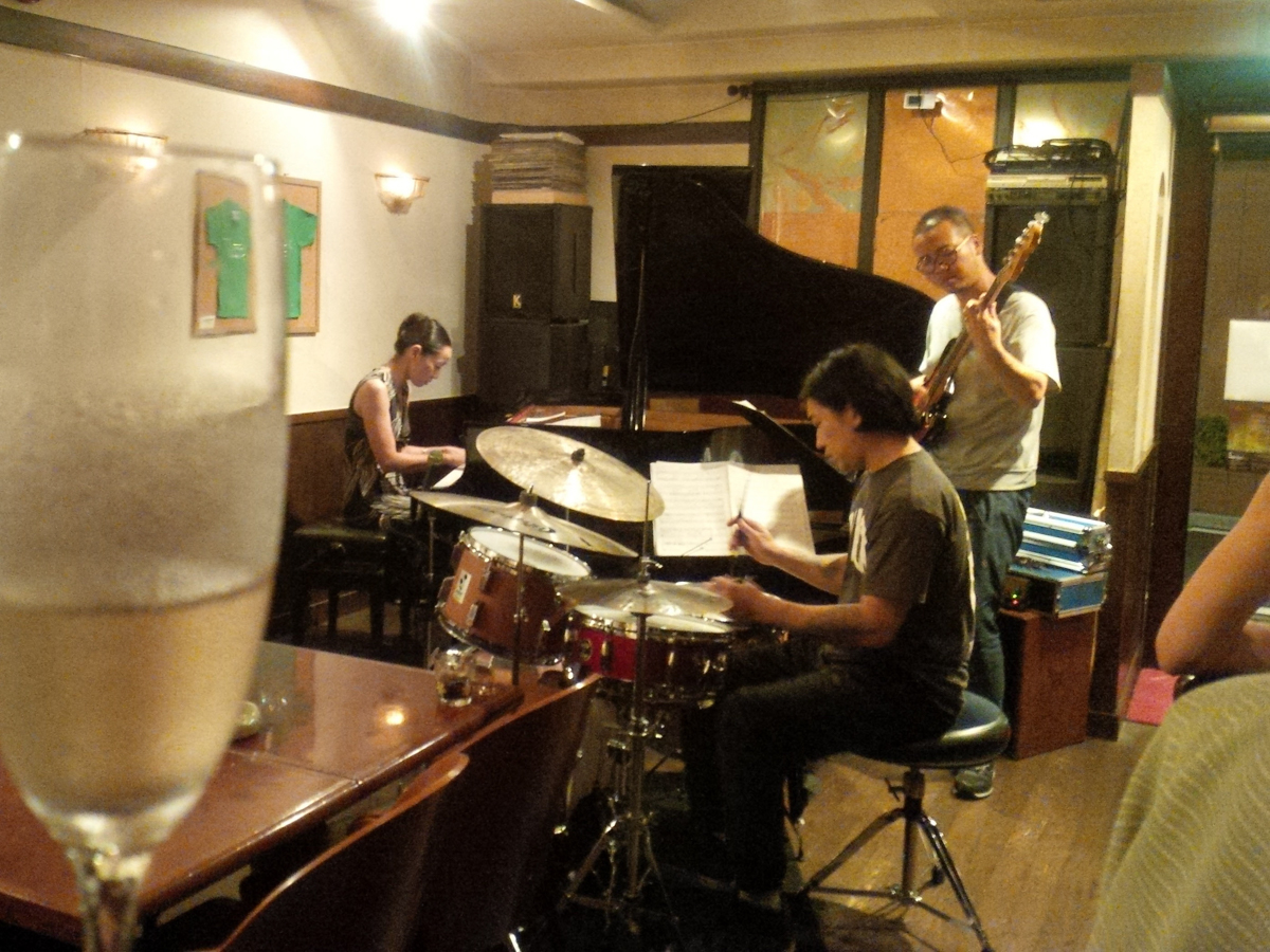 Figure 6: The Harumi Nomoto Trio with Ryoji Orihara on bass and Sohnozuke Imaizumi on drums at a jazz live & wine party at Nardis in 2016