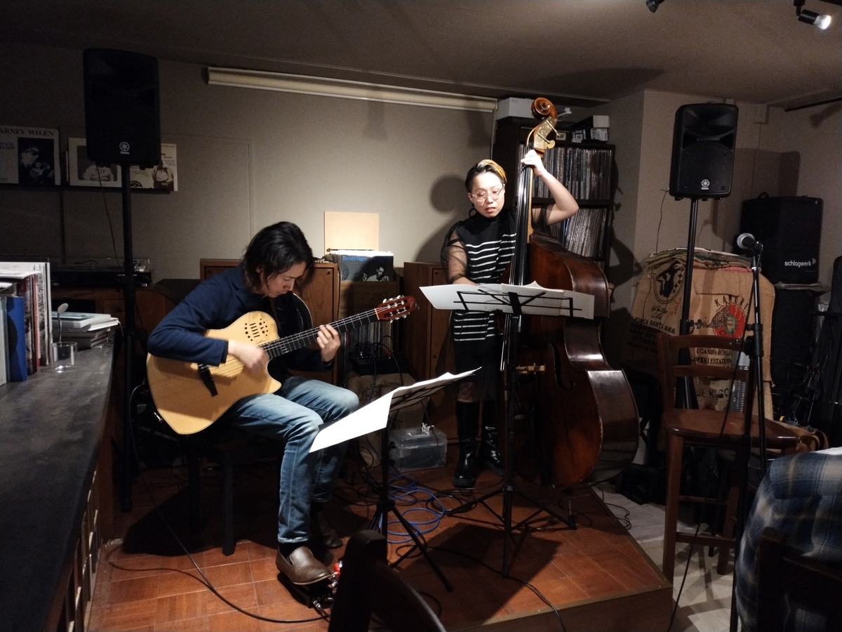 Figure 2: Hinako Hodoshima (bass) and Tsuyuki Tatsuya (guitar) at On A Slow Boat To&mldr; in March 2024