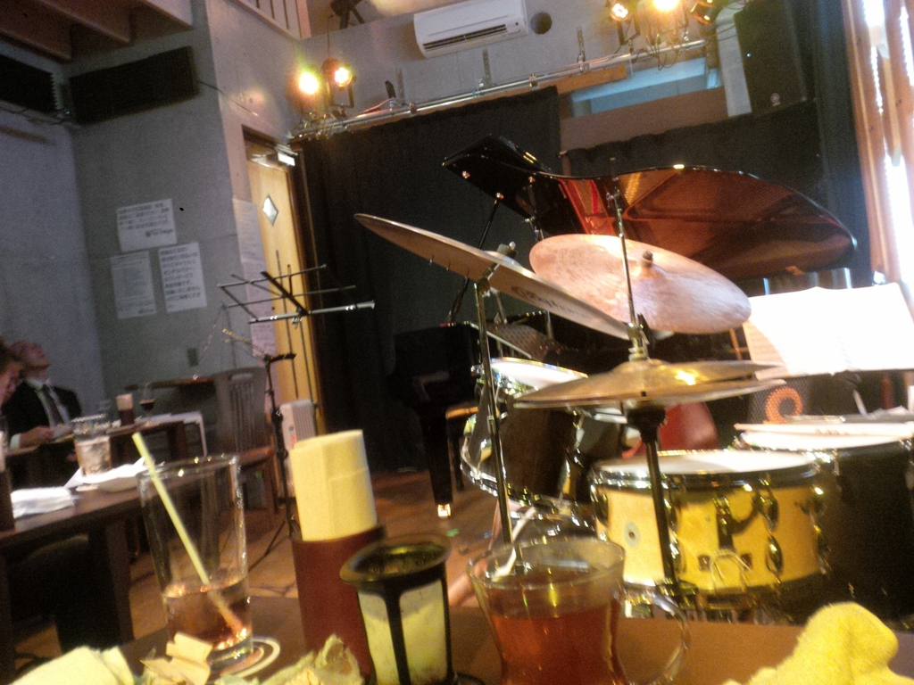 Figure 1: A front-row corner table positioned right up near the on-stage drum set.