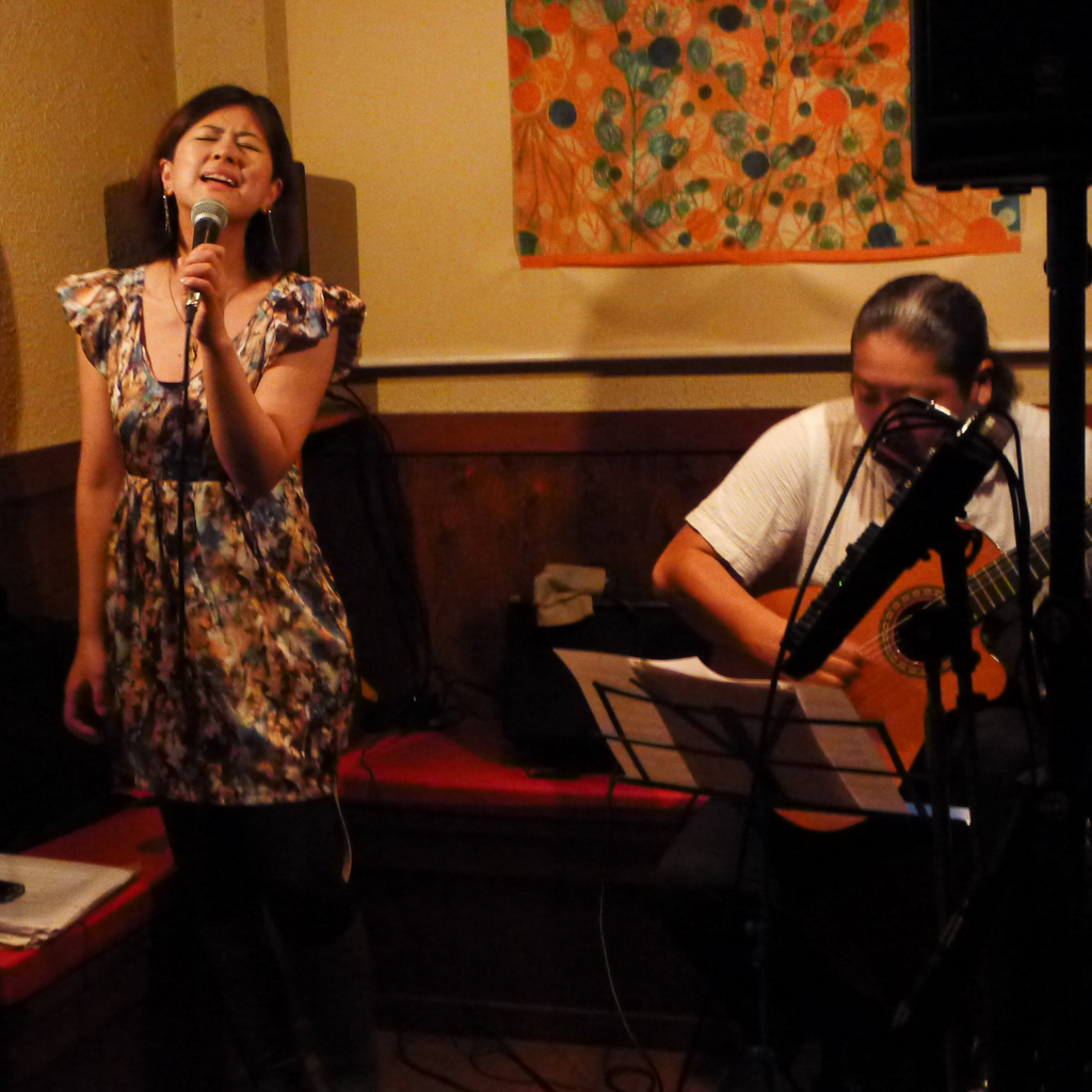 Figure 1: Singer Tomoka Miwa and guitarist Satoshi Aikawa at Porto in 2012