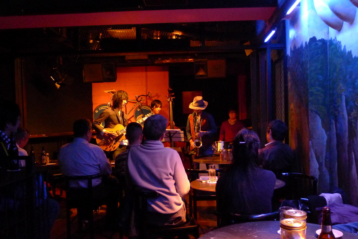 Figure 2: May Inoue (guitar), Shunya Wakai (bass), Masayo Koketsu (sax), and Yuto Maseki (drums) at Salt Peanuts in 2012
